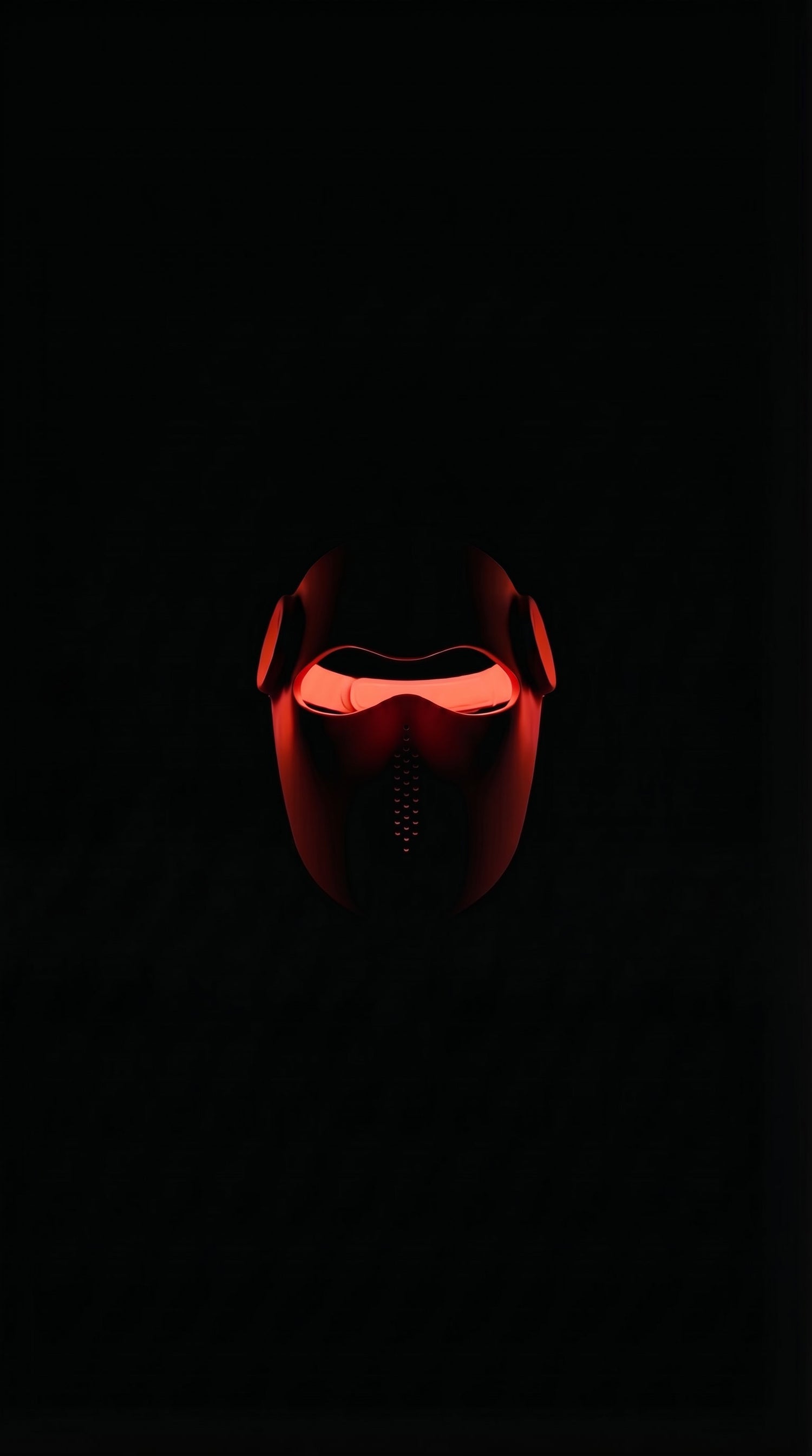 Red virtual reality headset on a black background