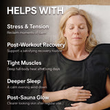 Woman using a black infrared sauna blanket for stress relief, workout recovery, tight muscles, sleep and skin glow