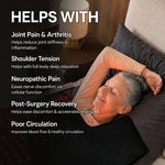 Person resting inside a full body red and infrared light therapy blanket at home
