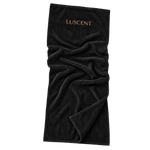 Opened black Luscent infrared sauna blanket insert with copper logo and soft cotton folds